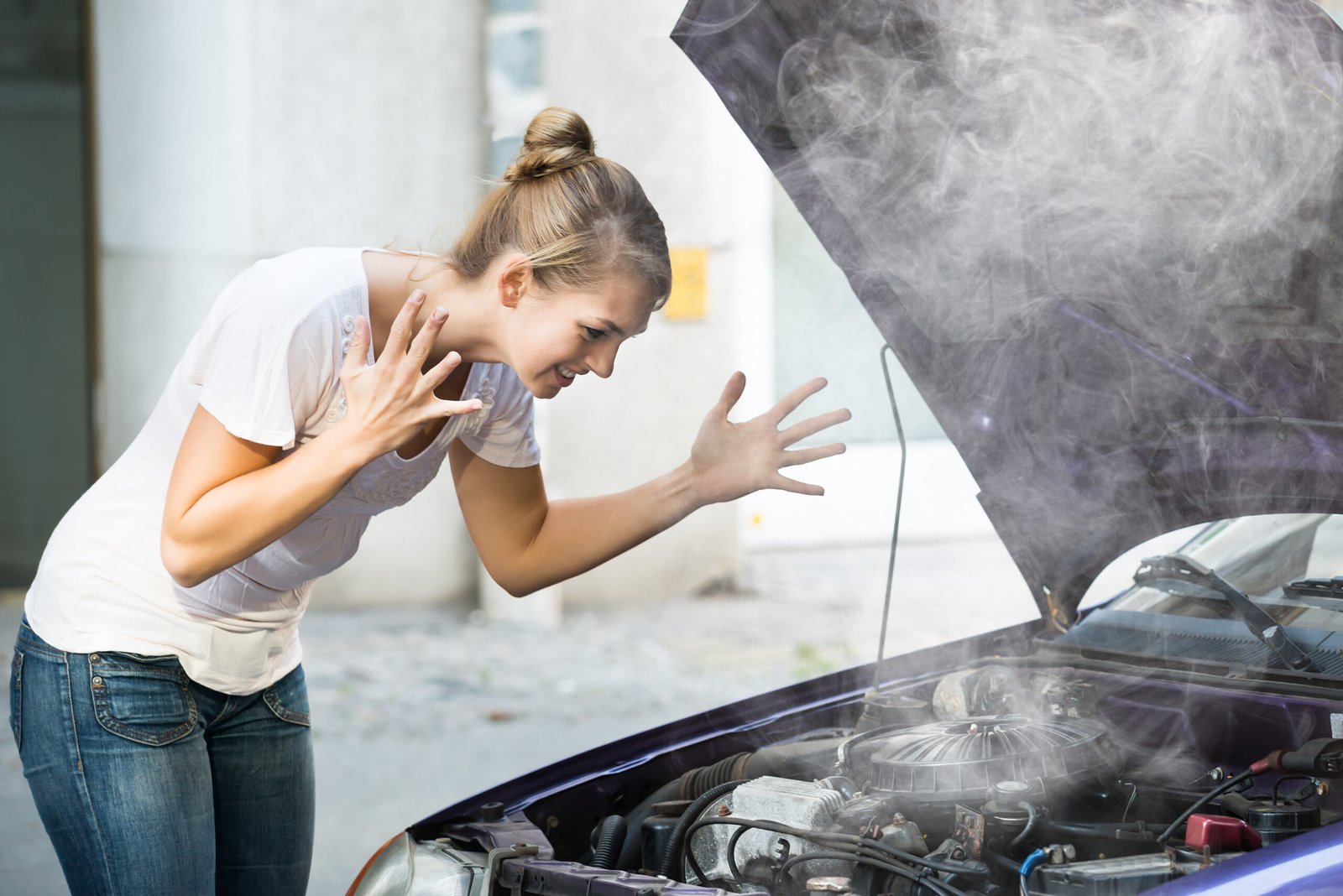 10 Car Engine Problems: Warning Signs You Shouldn’t Ignore 1 Frustrated Lady facing Car Engine Problems